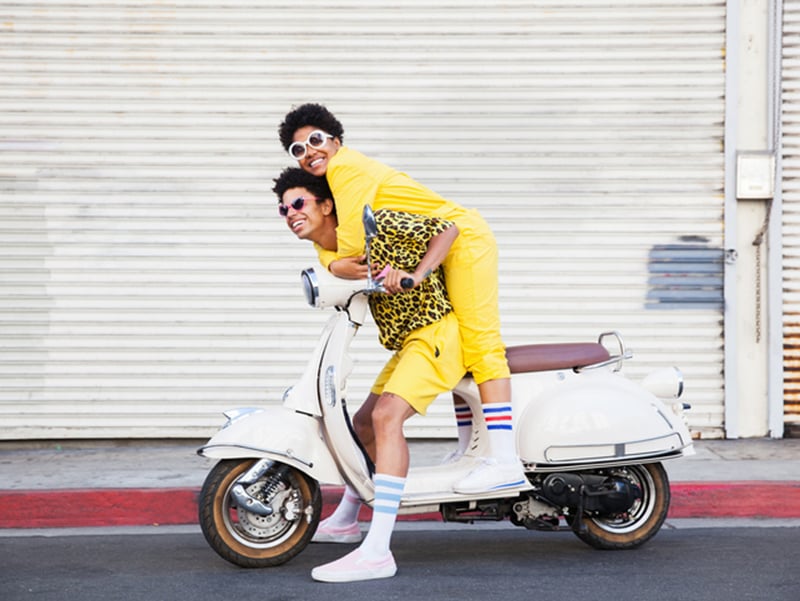 two people on a moped