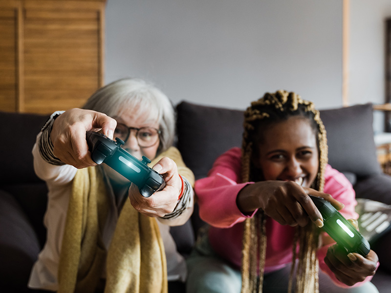 two women play a video game