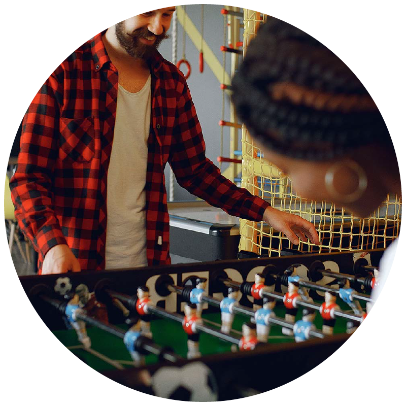 Two people playing foosball