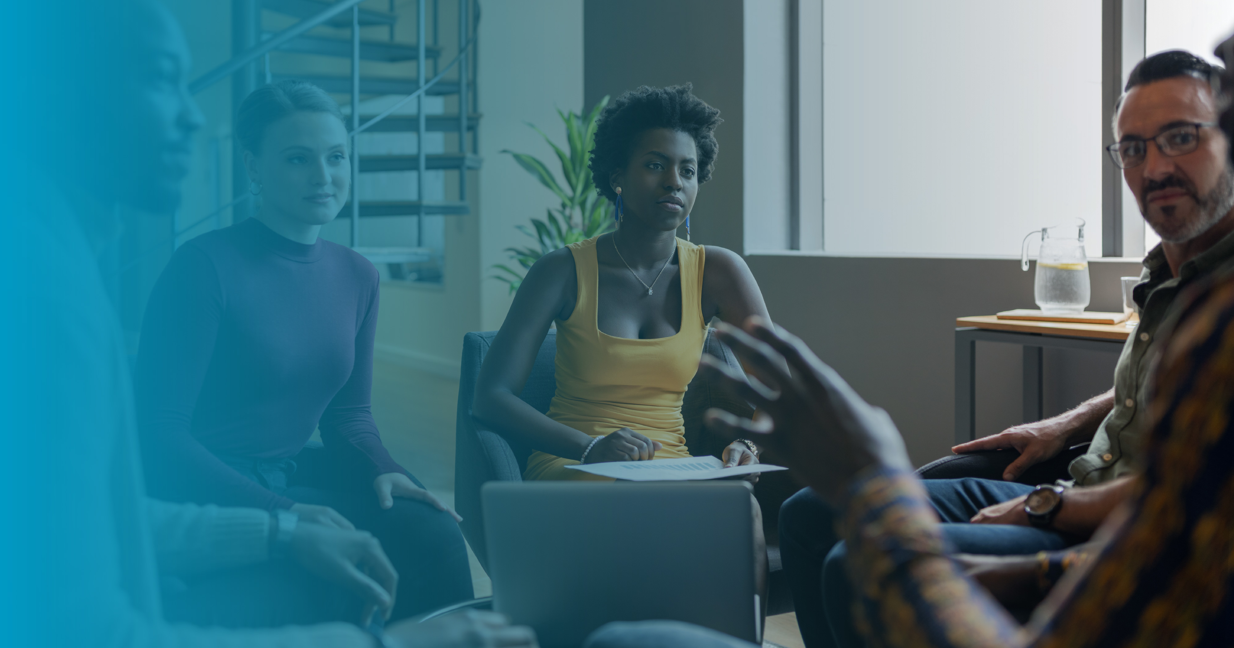 Group of office workers sitting in a circle and having a discussion