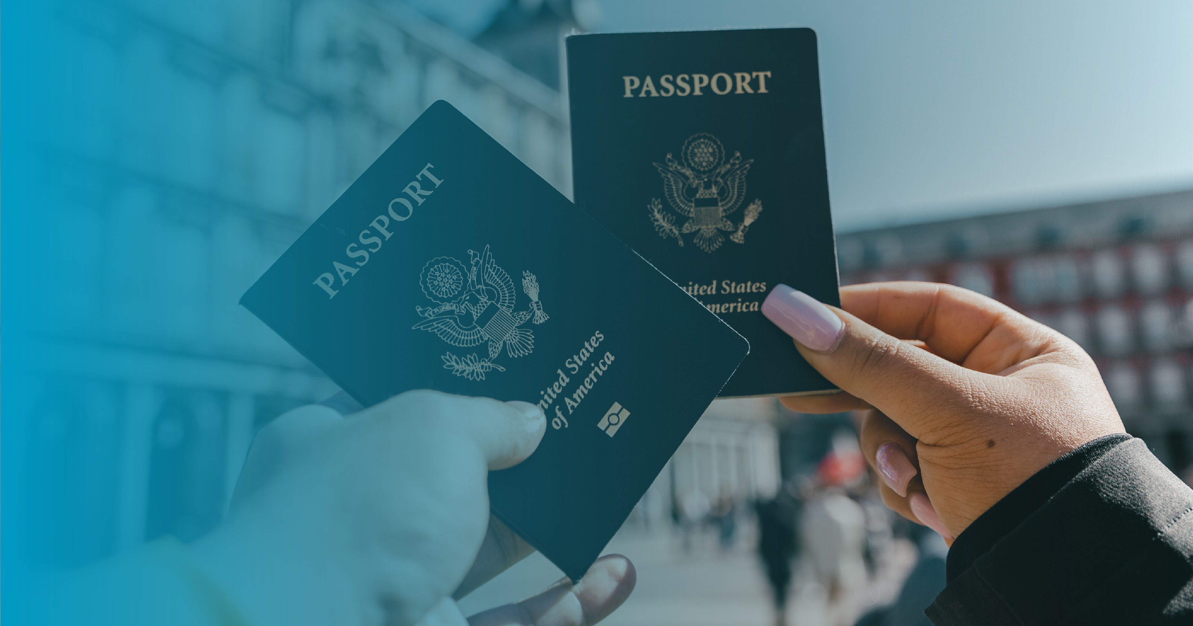 Two people holding U.S. passports