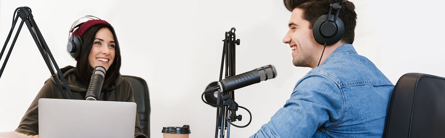 a man and a woman hosting a podcast