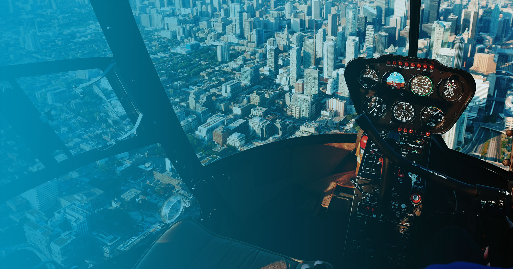 View of a major city from the pilot's seat of an airplane.