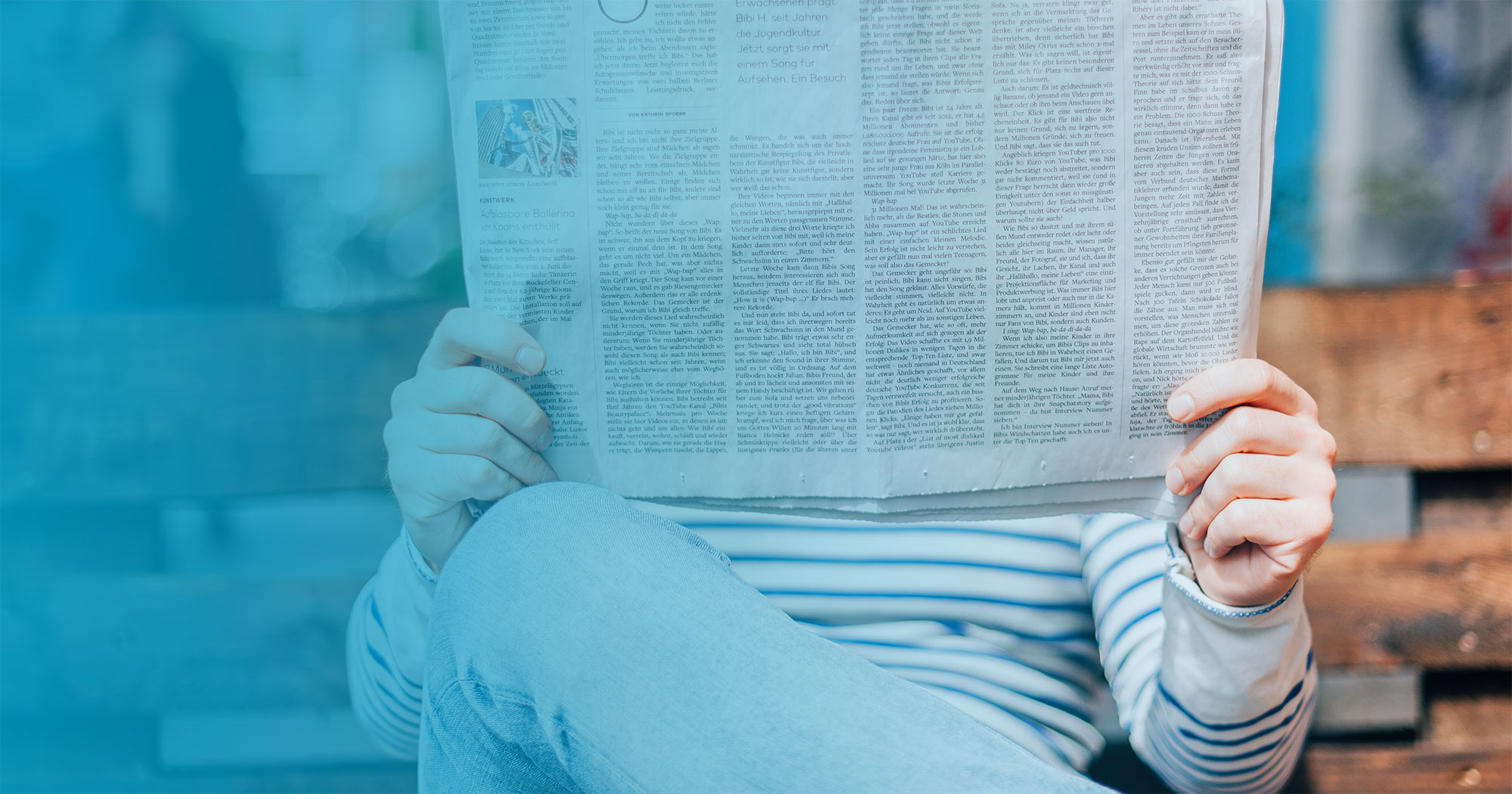 Person reading newspaper