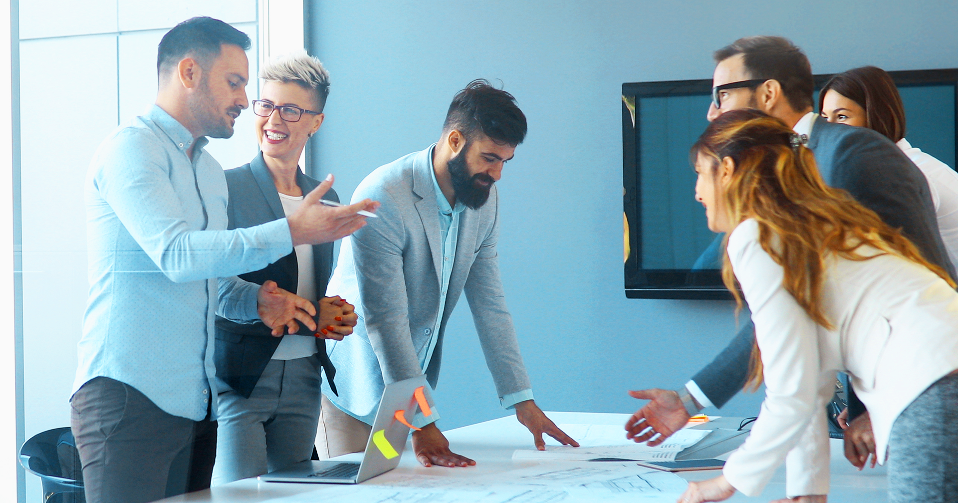 A group of office workers planning around a table