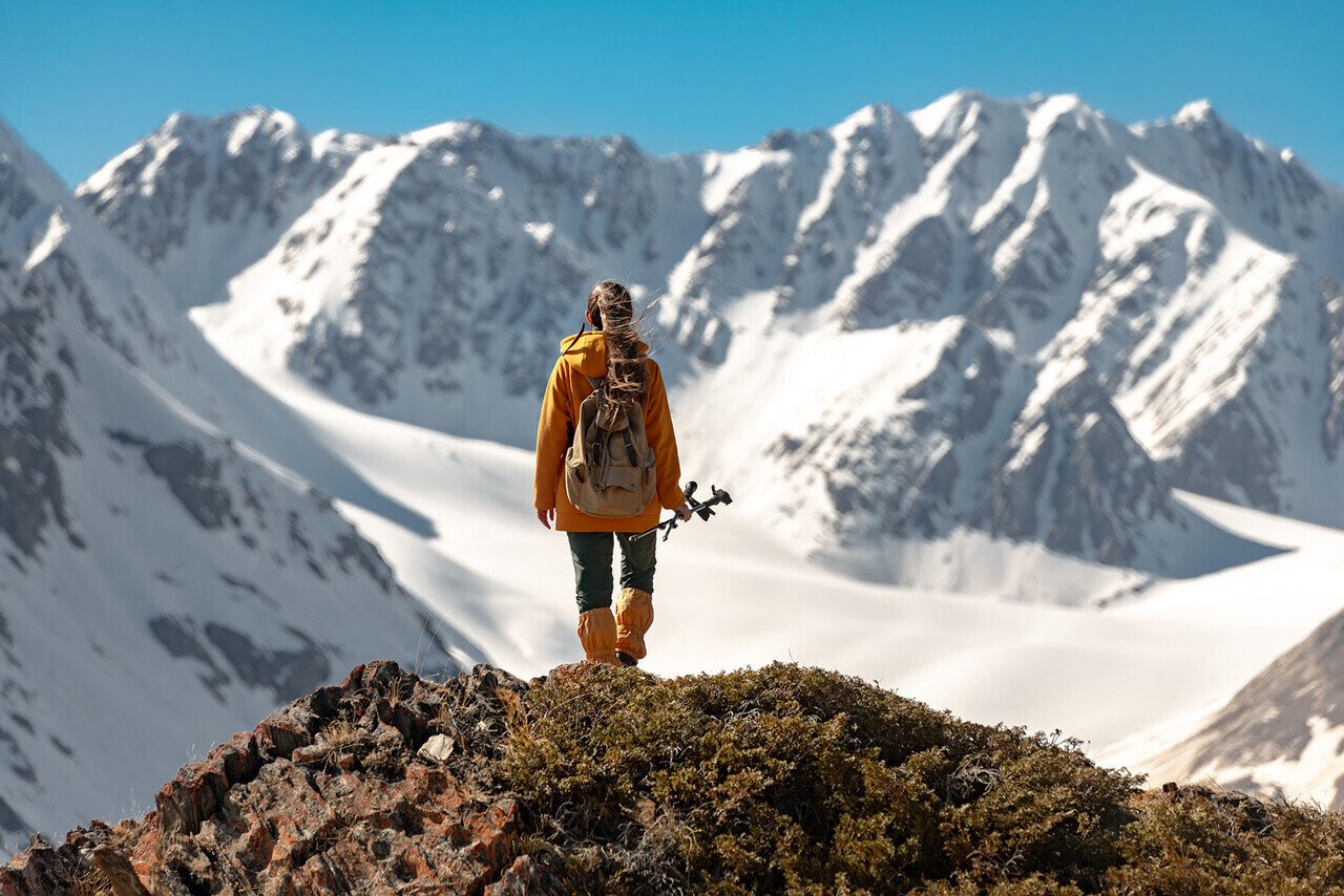 a female hiker looking into the mountains