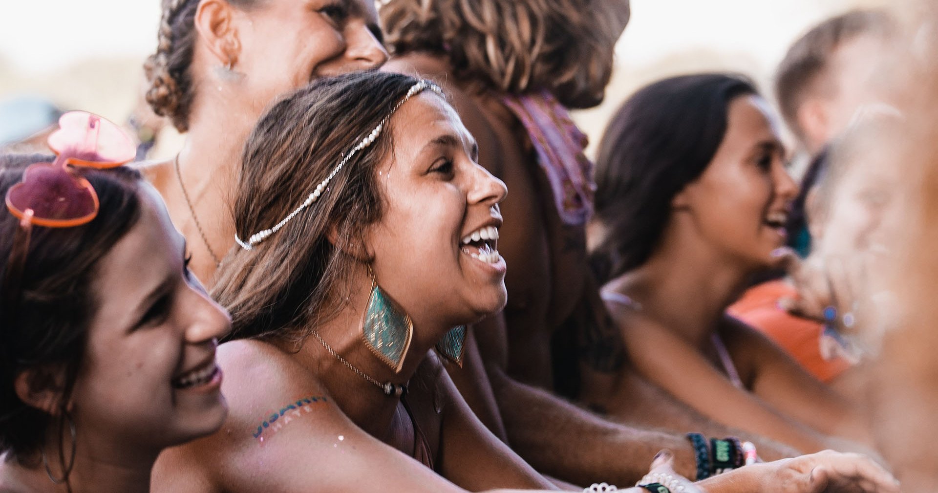 Women cheering at an outdoor concert